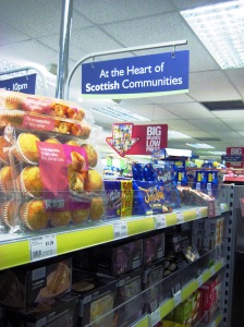 Inside a Scotmid store showing sign reading 'At the Heart of Scottish Communities'